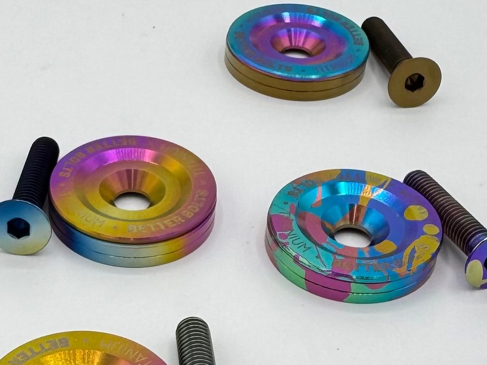 Better Bolts titanium top caps and bolts anodized in fades and splatter