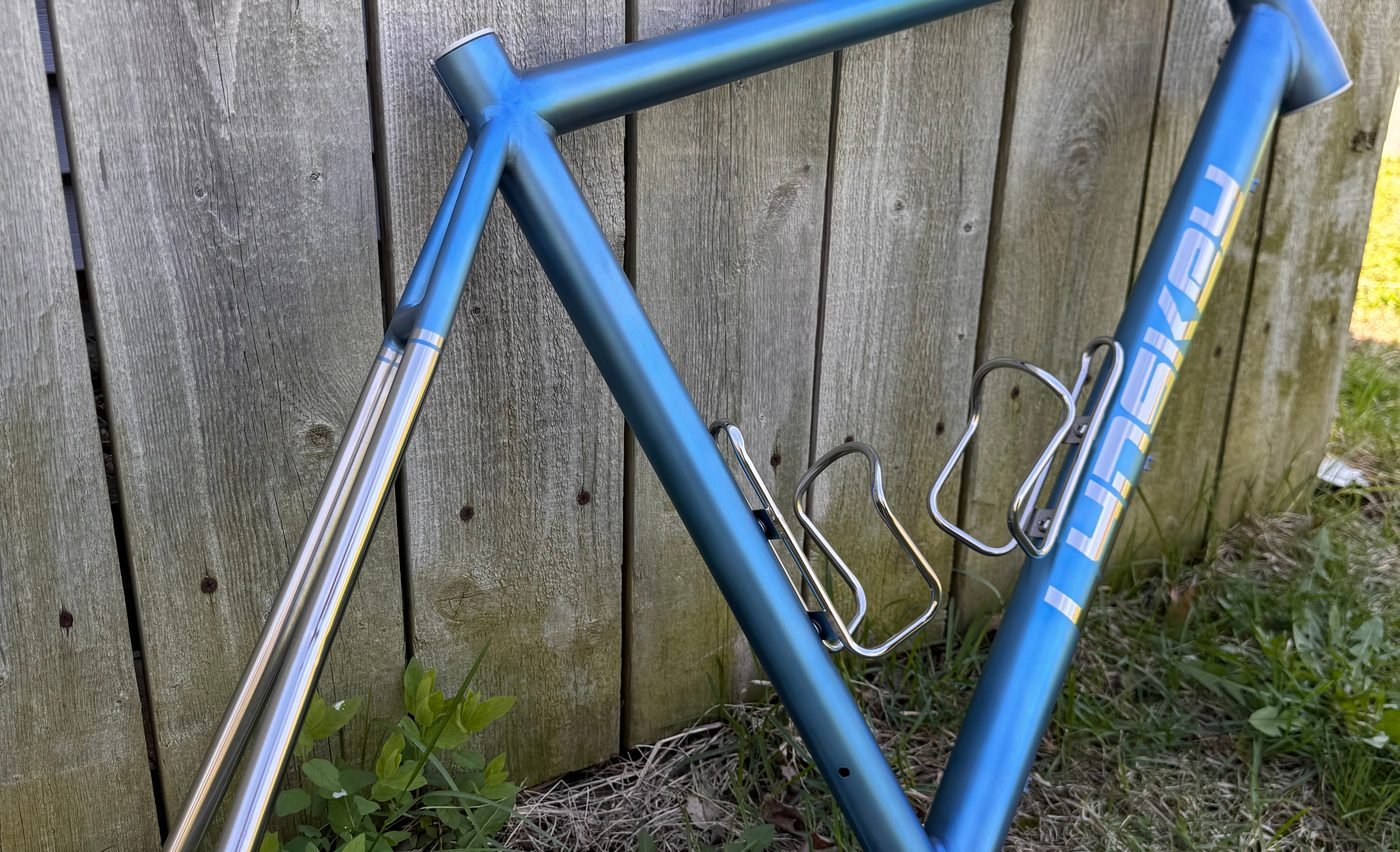 Lynskey titanium frame anodized in a blue fade against raw polished stays