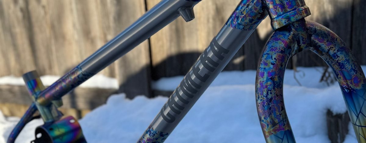 Splatter-anodized titanium BMX frameset and fork with a faceted colour panel